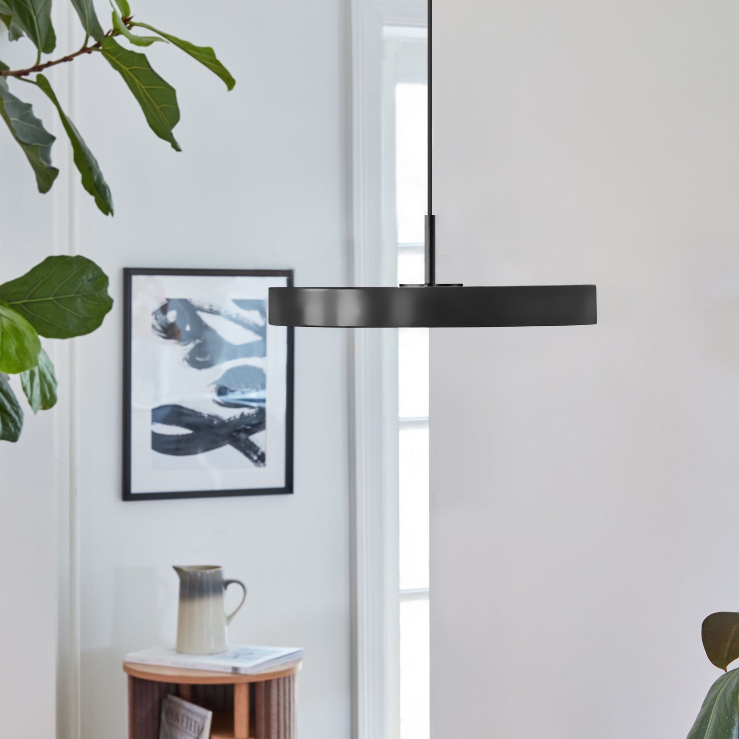 UMAGE Asteria Mini LED Pendant in Black with Black Connector — styled interior view