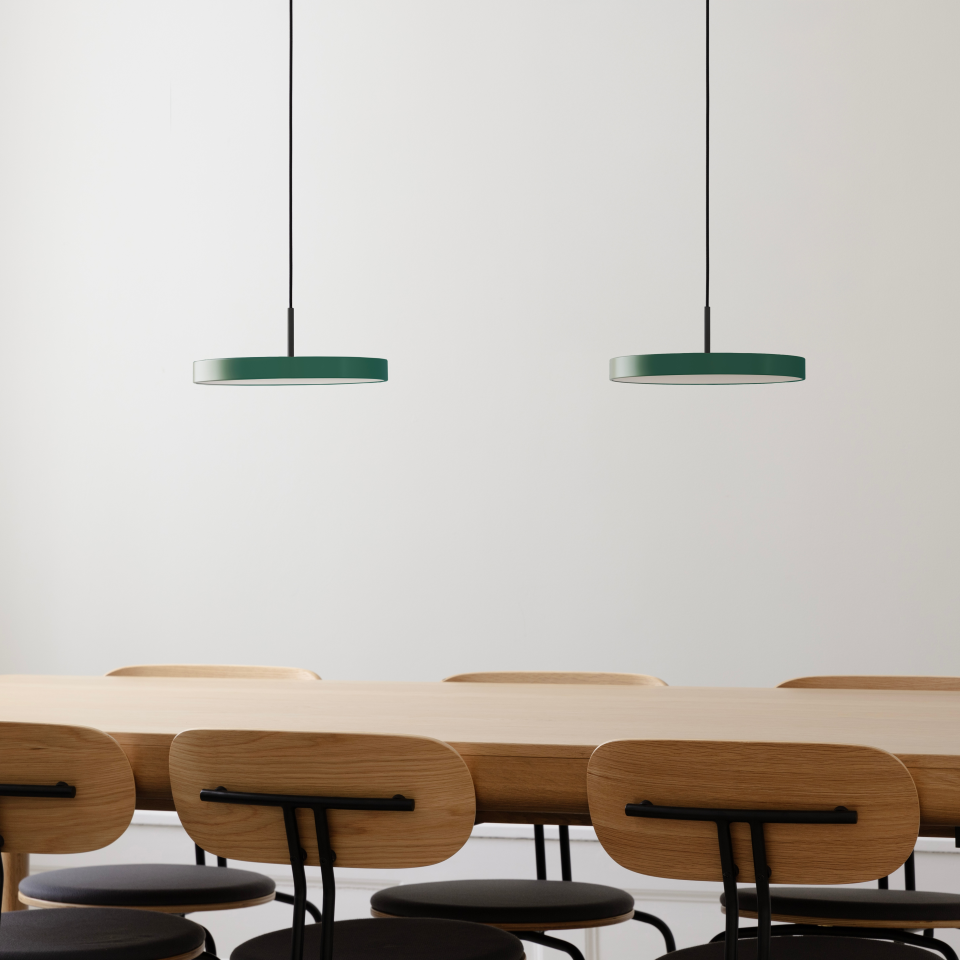 UMAGE Asteria Mini LED Pendant in Forest Green with Black Connector — styled interior view
