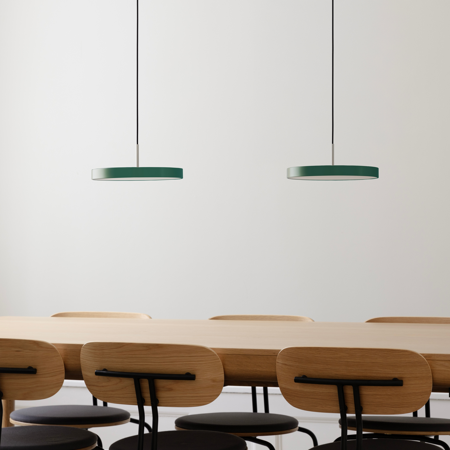 UMAGE Asteria Mini LED Pendant in Forest Green with Steel Connector — styled interior view