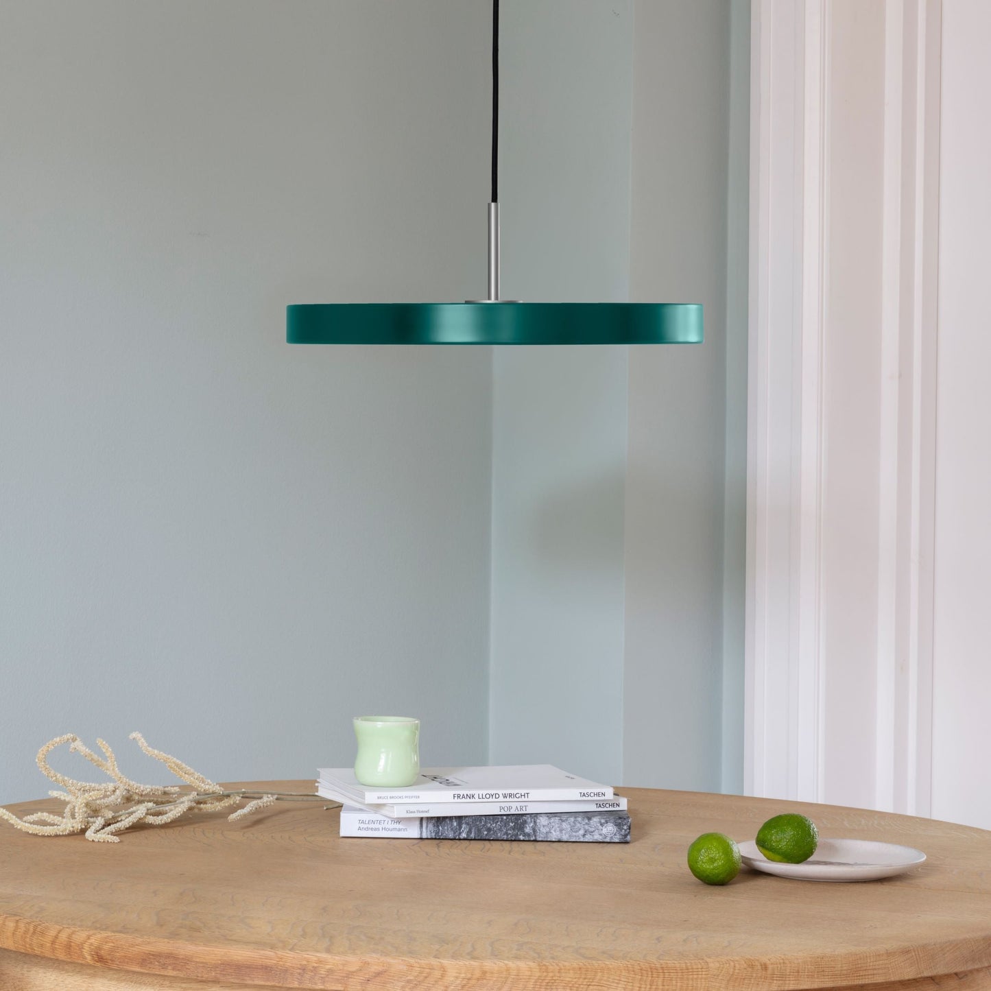UMAGE Asteria LED Pendant in Forest Green with Steel Connector — styled interior view