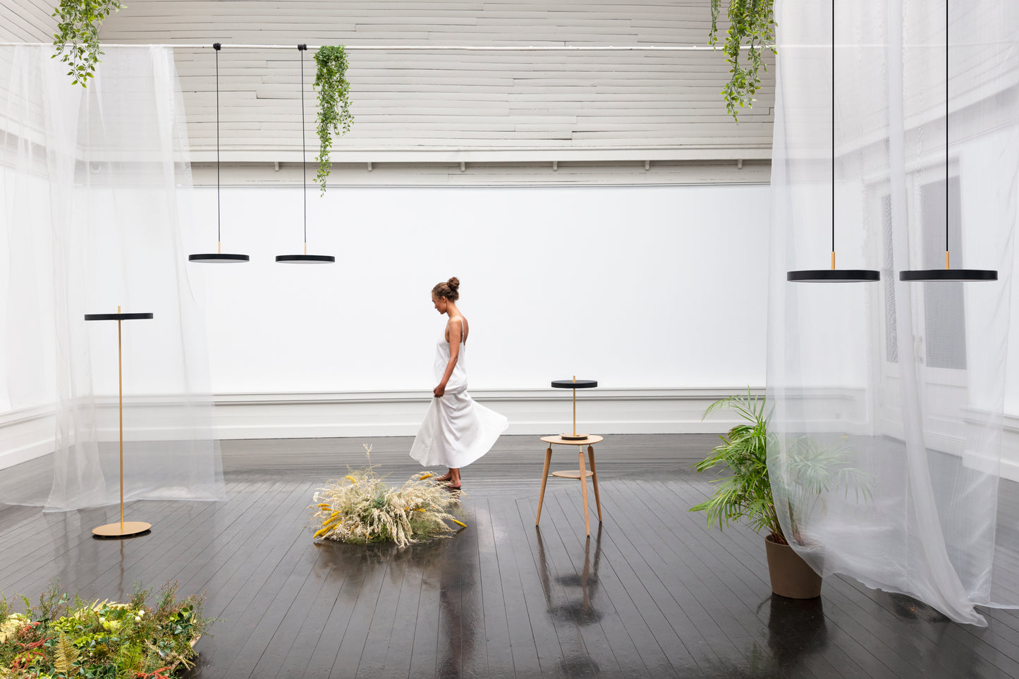 UMAGE Asteria LED Table Lamp in Black — styled interior view 2