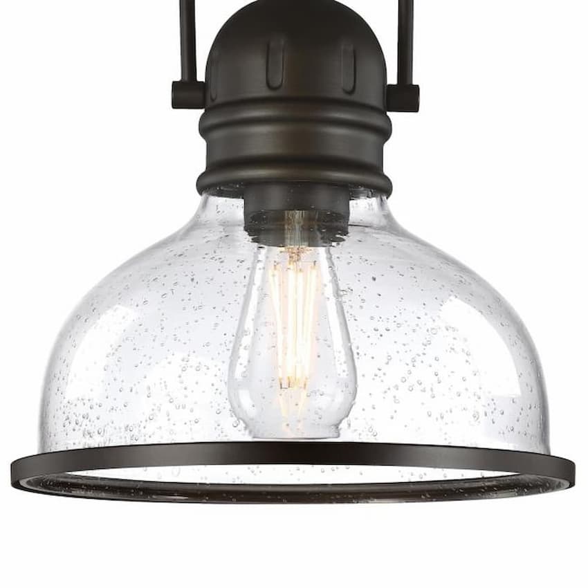 Westinghouse Boswell 6132100 indoor pendant featuring a vintage-inspired black-bronze finish and elegant clear seeded glass
