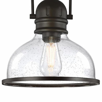 Westinghouse Boswell 6132100 indoor pendant featuring a vintage-inspired black-bronze finish and elegant clear seeded glass