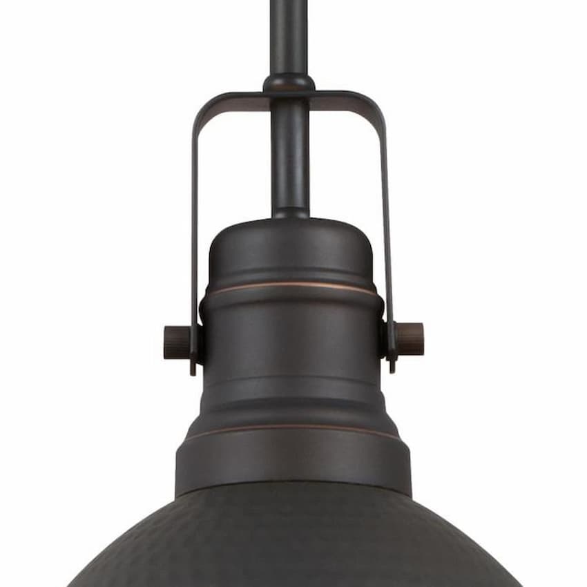 Westinghouse Madras 6345600 indoor mini pendant featuring a richly textured hammered dome shade in oil rubbed bronze with highlights