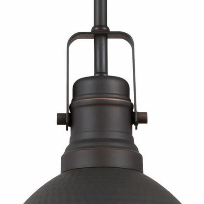 Westinghouse Madras 6345600 indoor mini pendant featuring a richly textured hammered dome shade in oil rubbed bronze with highlights