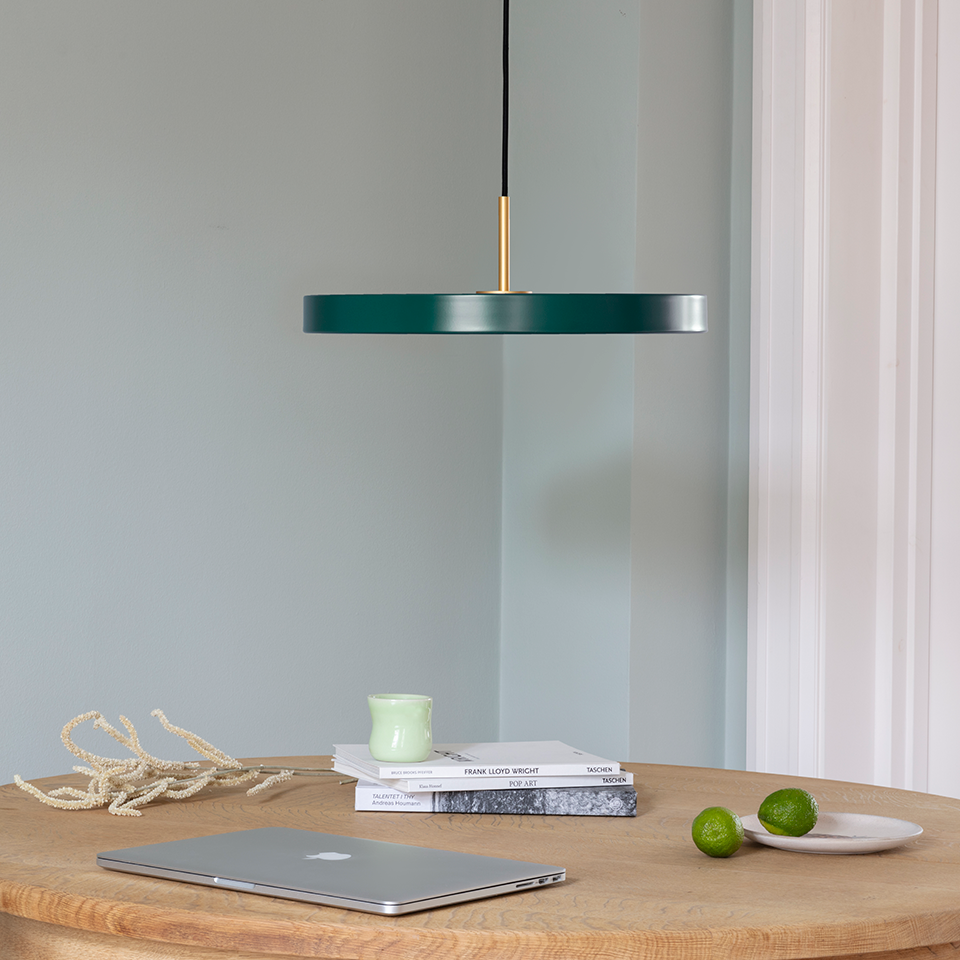 UMAGE Asteria LED Pendant in Forest Green with Brass Connector — styled interior view 2