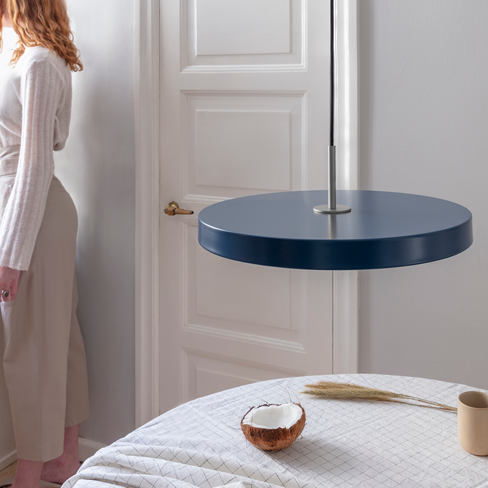 UMAGE Asteria LED Pendant in Petrol Blue with Steel Connector — styled interior view