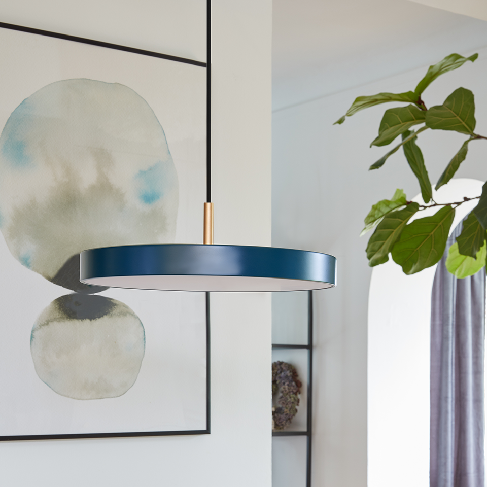 UMAGE Asteria Mini LED Pendant in Petrol Blue with Brass Connector — styled interior view