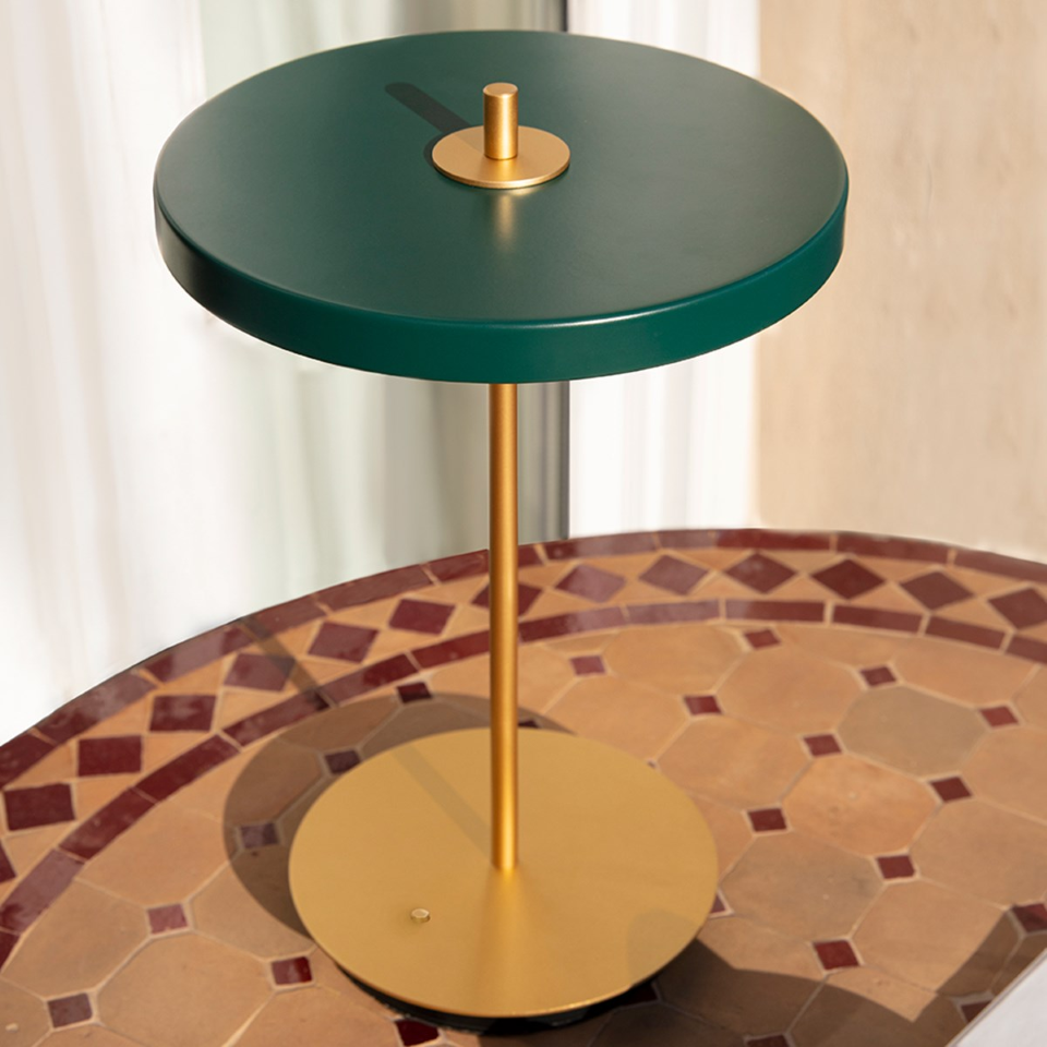 UMAGE Asteria Move LED Portable Table Lamp in Forest Green — styled interior view