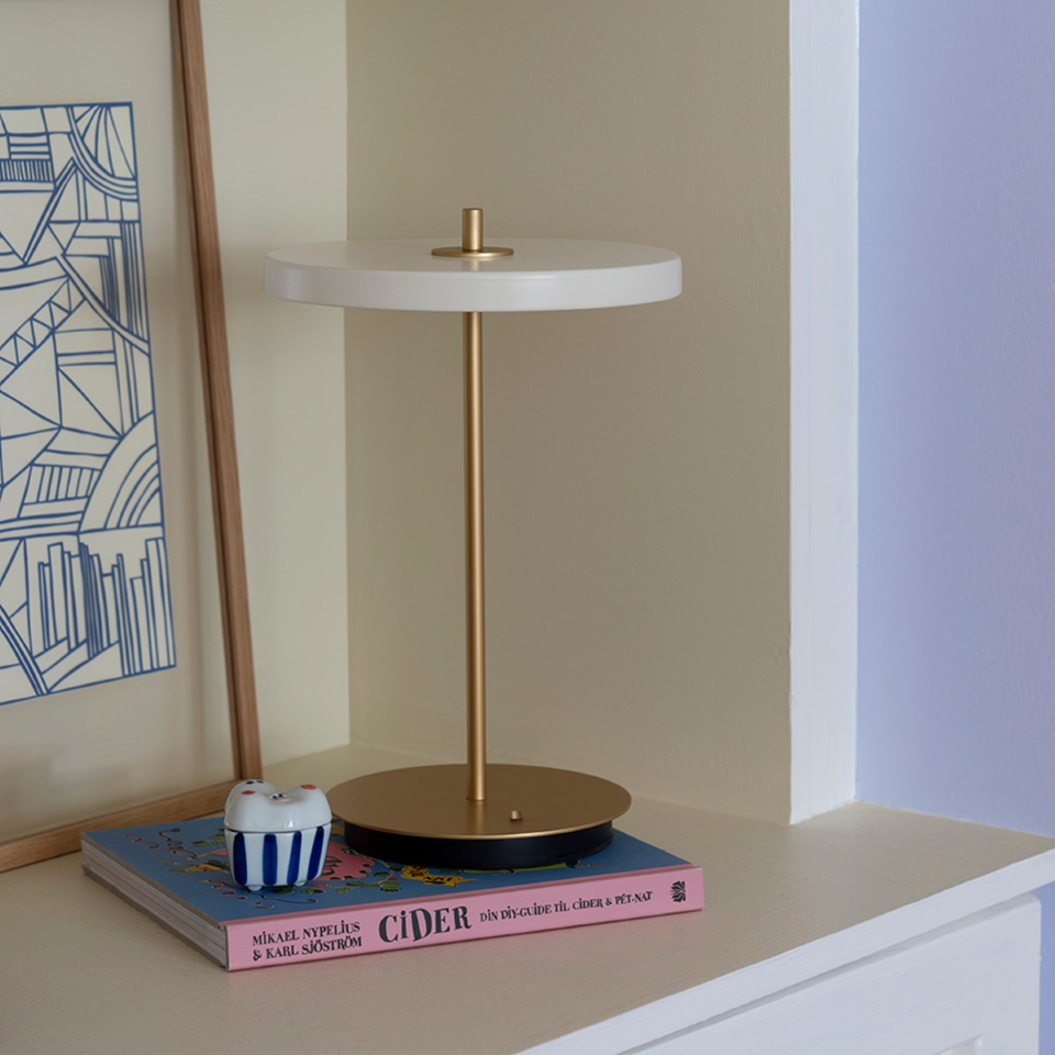 UMAGE Asteria Move LED Portable Table Lamp in Pearl White — styled interior view