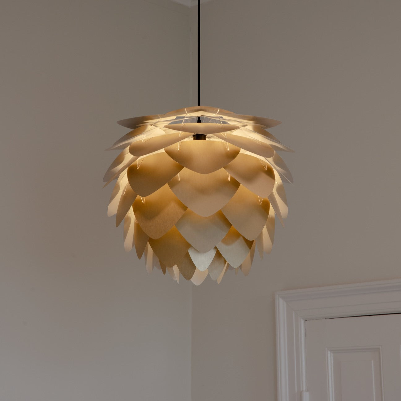 UMAGE Aluvia Medium Brushed Brass Replacement Shade — styled interior view