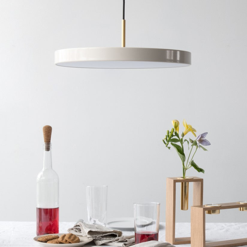 UMAGE Asteria LED Pendant in Pearl White with Brass Connector — styled interior view 4