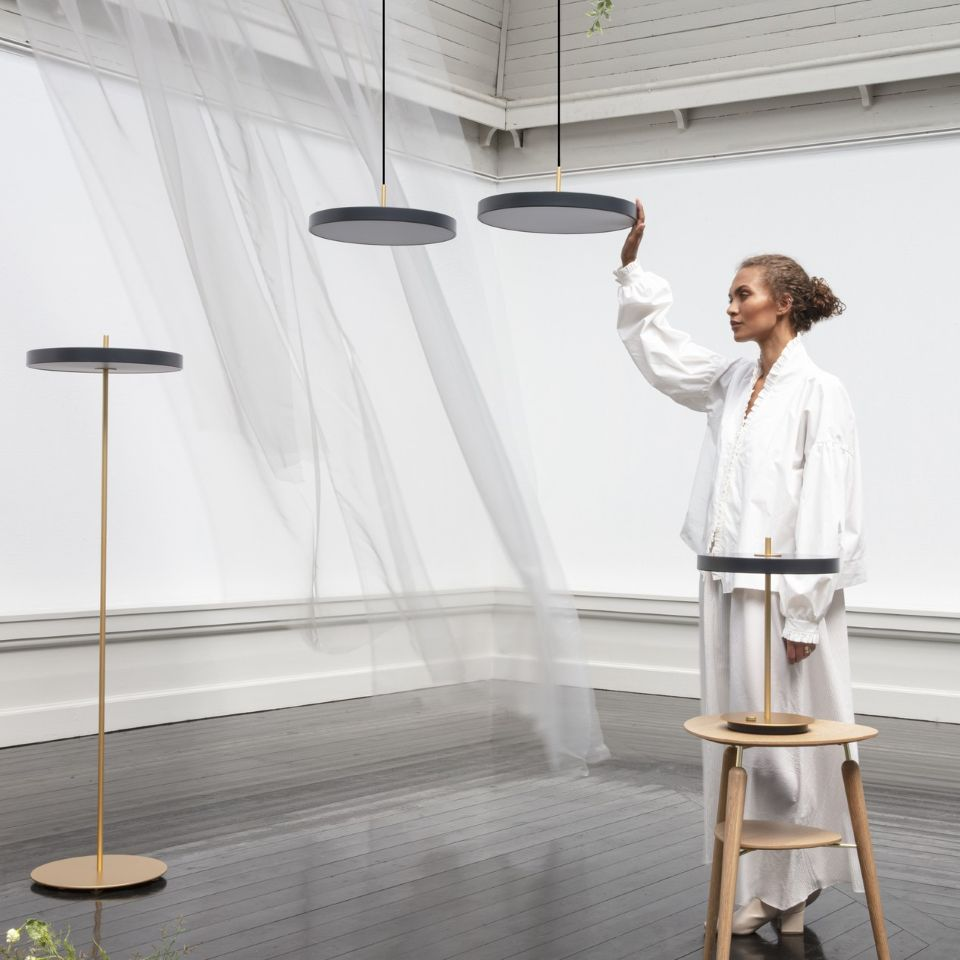 UMAGE Asteria LED Floor Lamp in Anthracite Grey — styled interior view 2