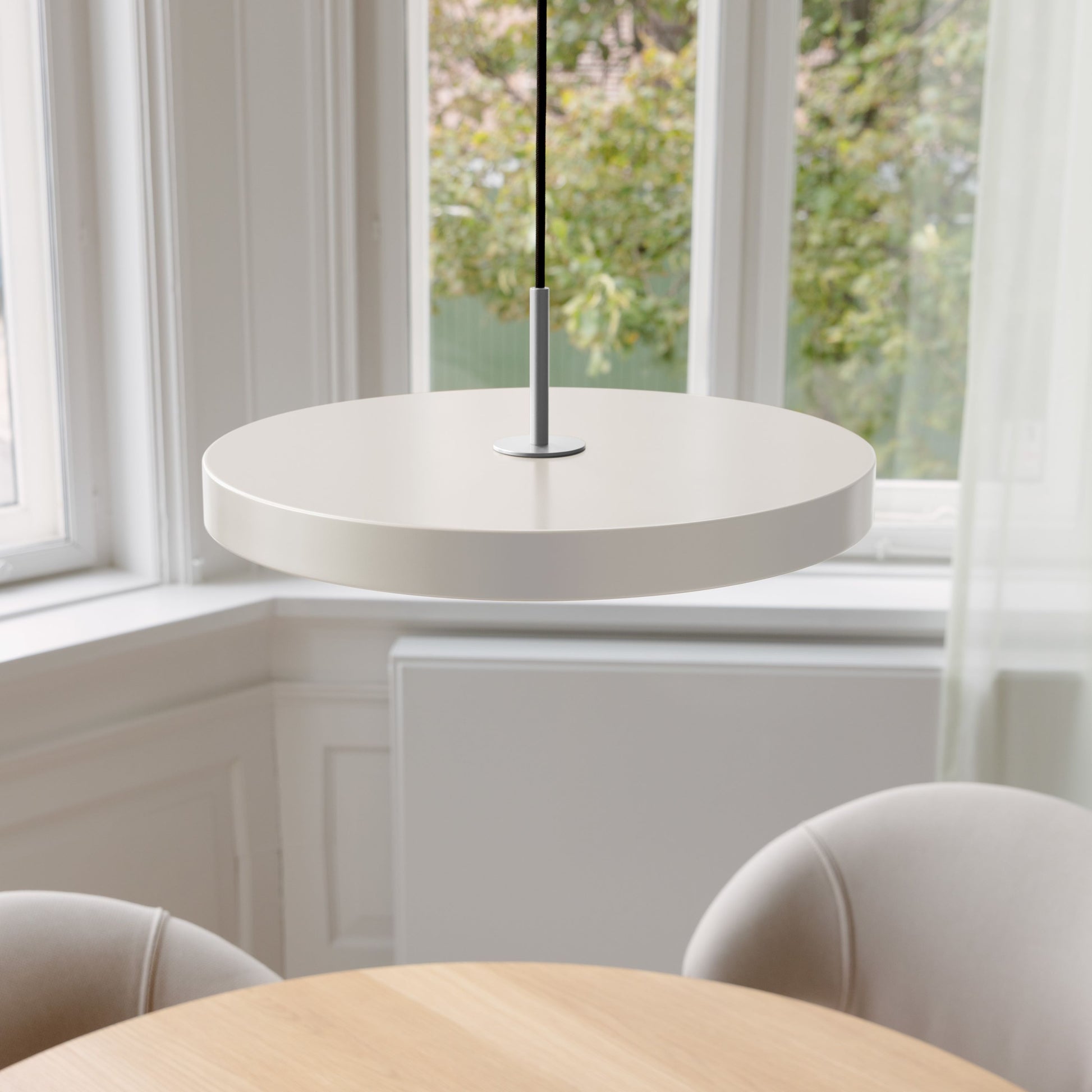 UMAGE Asteria LED Pendant in Pearl White with Steel Connector — styled interior view