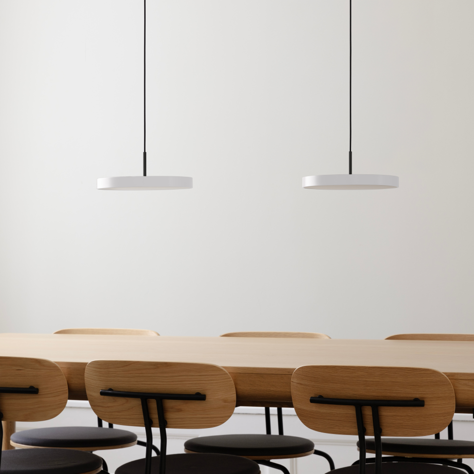 UMAGE Asteria Mini LED Pendant in Pearl White with Black Connector — styled interior view 2