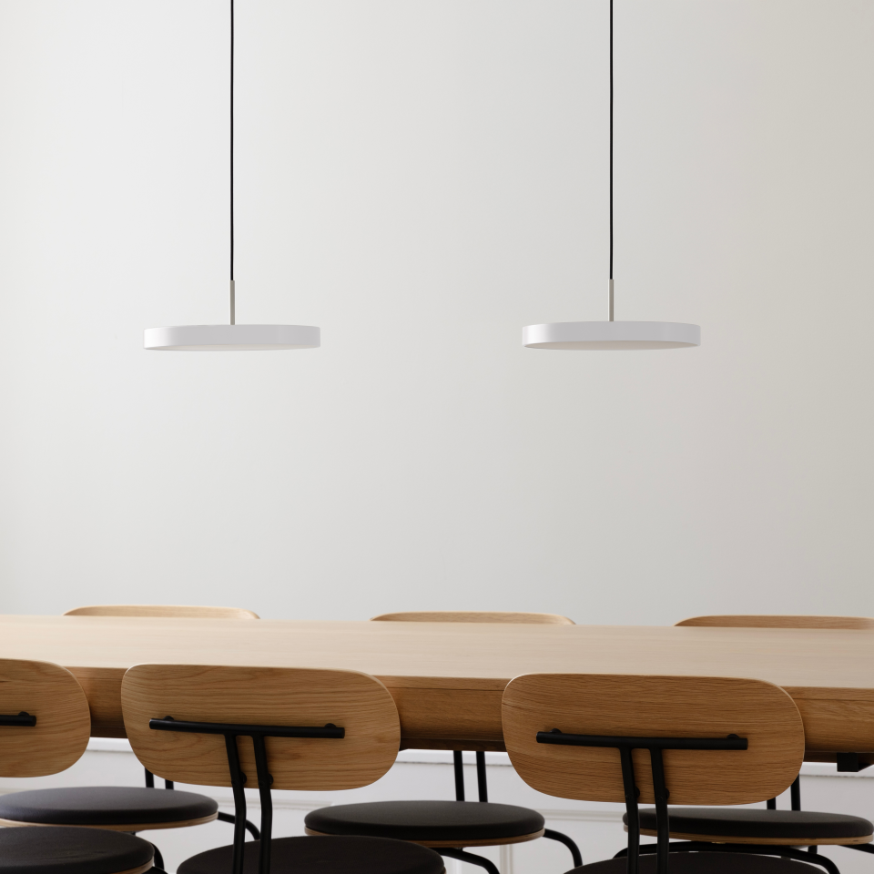 UMAGE Asteria Mini LED Pendant in Pearl White with Steel Connector — styled interior view
