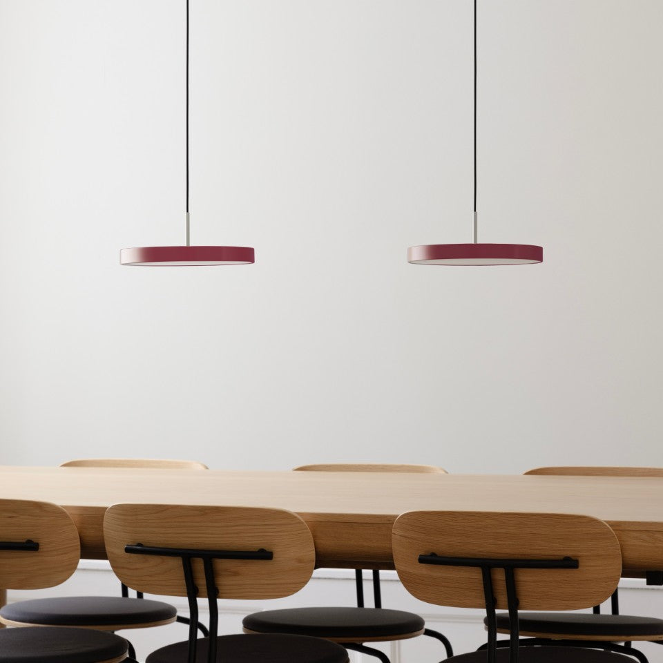 UMAGE Asteria Mini LED Pendant in Ruby Red with Steel Connector — styled interior view