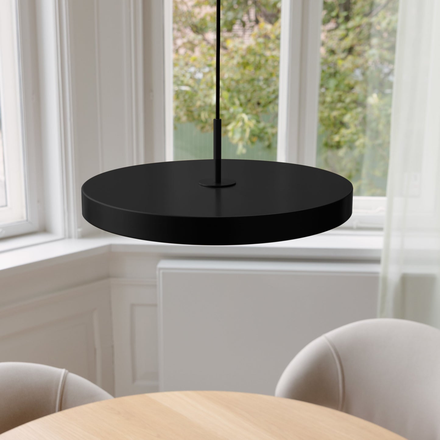 UMAGE Asteria LED Pendant in Black with Black Connector — styled interior view 3