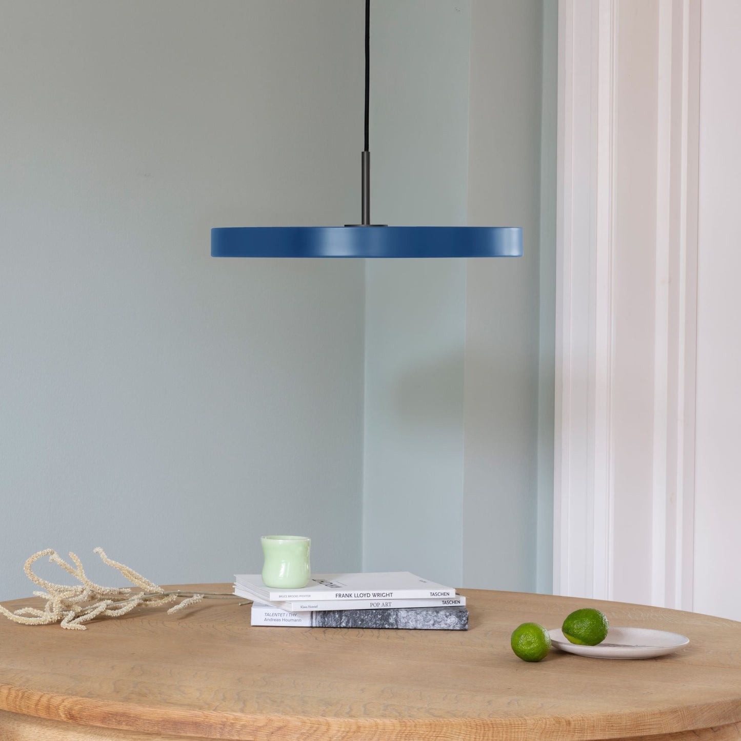 UMAGE Asteria LED Pendant in Petrol Blue with Black Connector — styled interior view