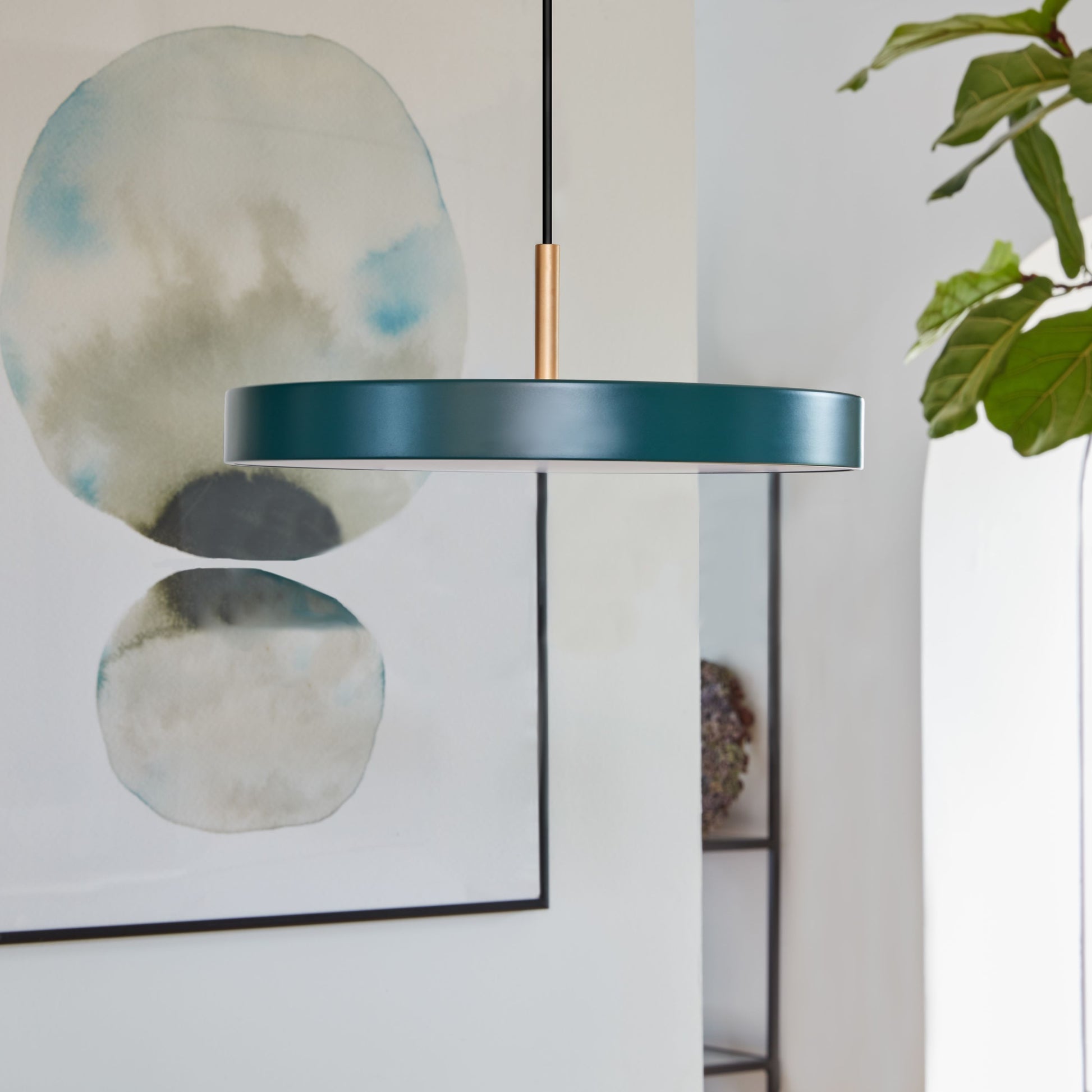 UMAGE Asteria Mini LED Pendant in Forest Green with Brass Connector — styled interior view