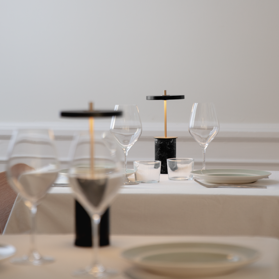 UMAGE Asteria Move Mini Portable Table Lamp - Black — styled interior view