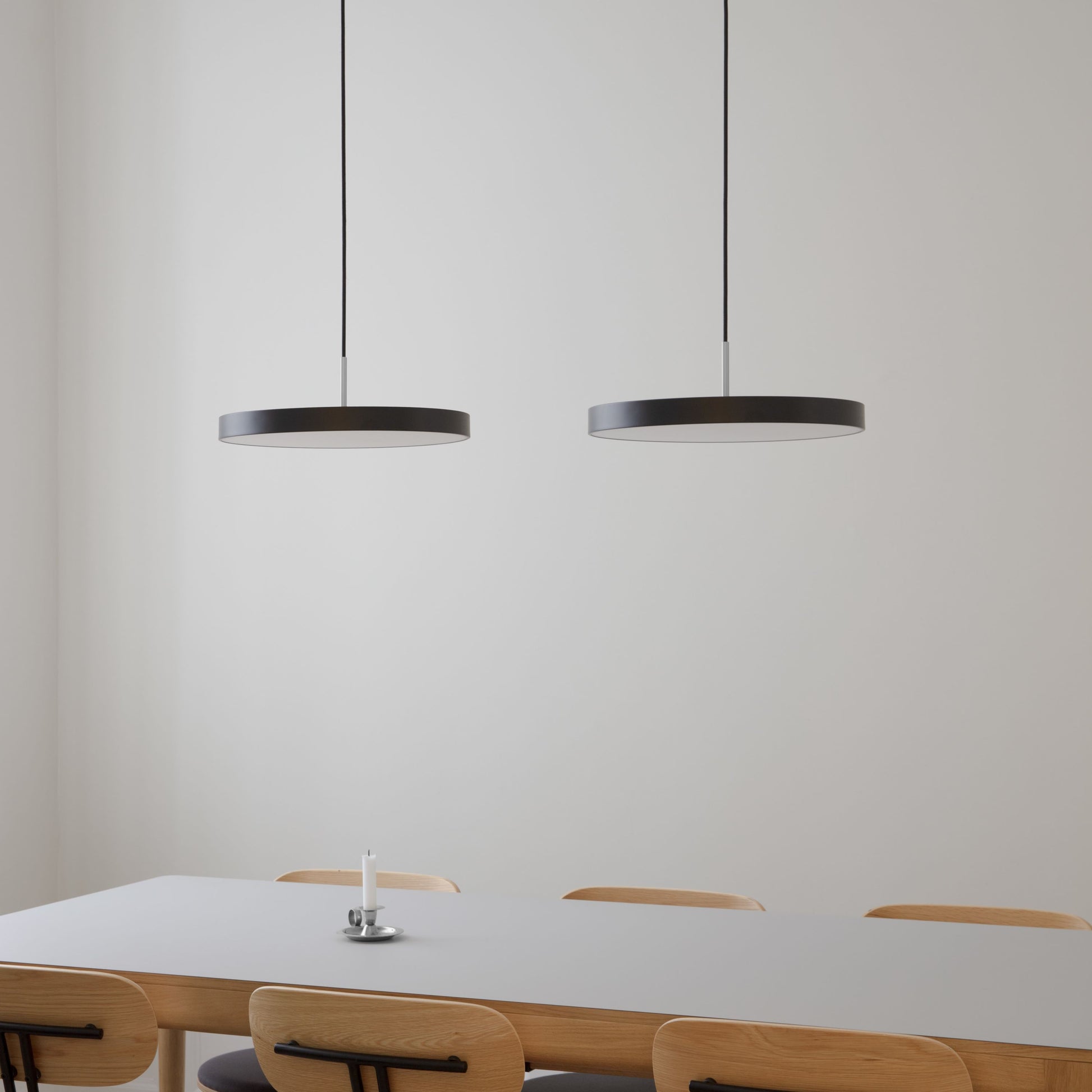 UMAGE Asteria LED Pendant in Black with Steel Connector — styled interior view 2