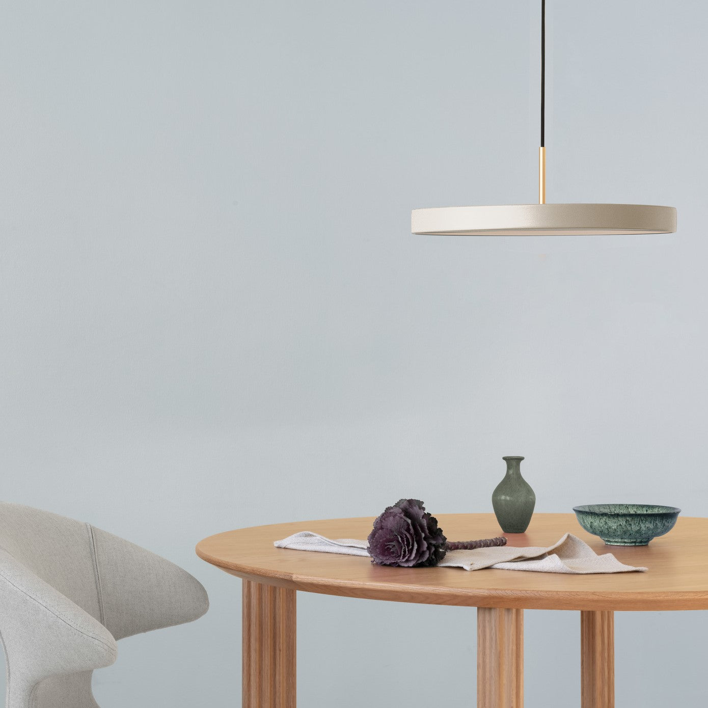 UMAGE Asteria LED Pendant in Pearl White with Brass Connector — styled interior view 6