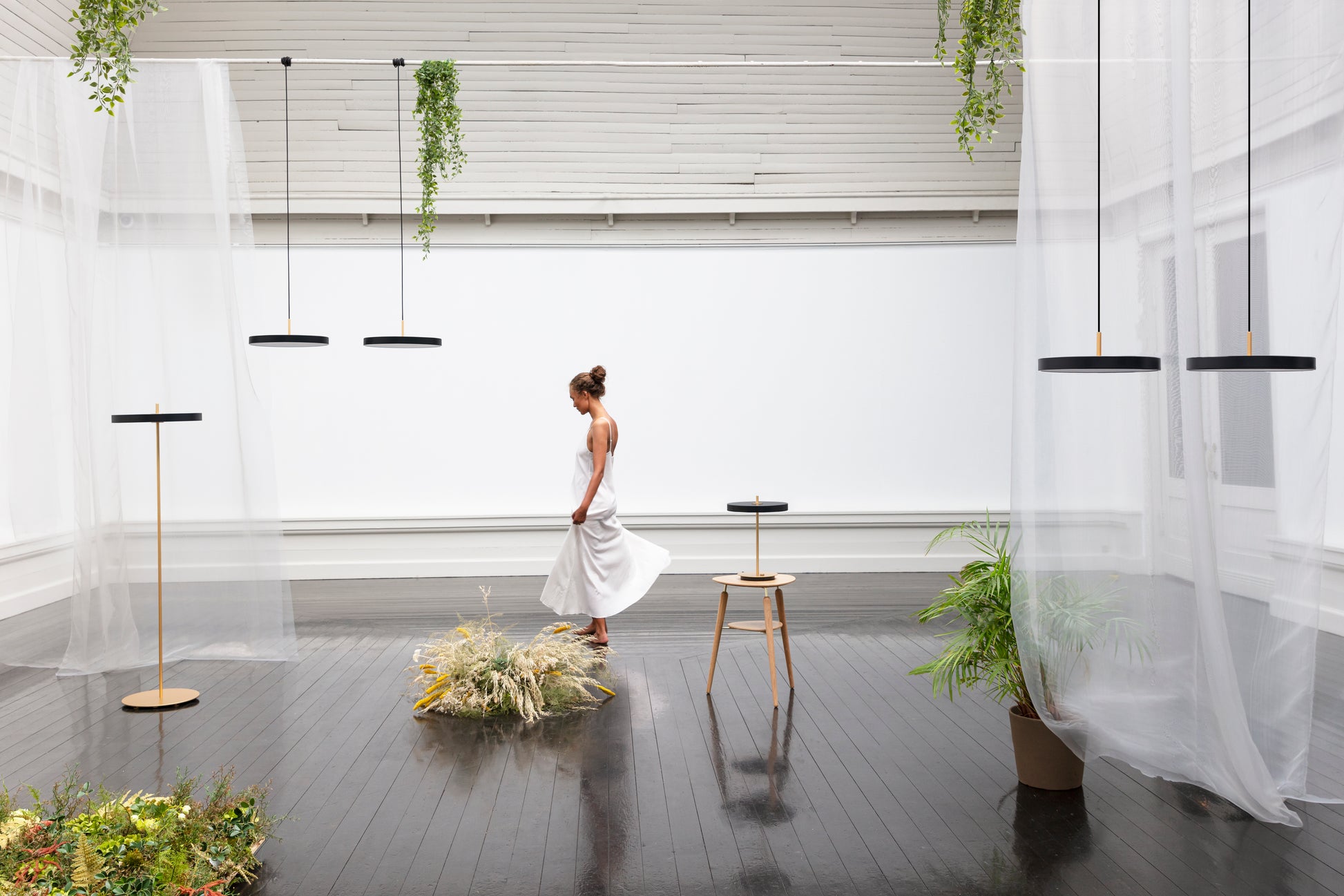 UMAGE Asteria LED Table Lamp in Black — styled interior view 2
