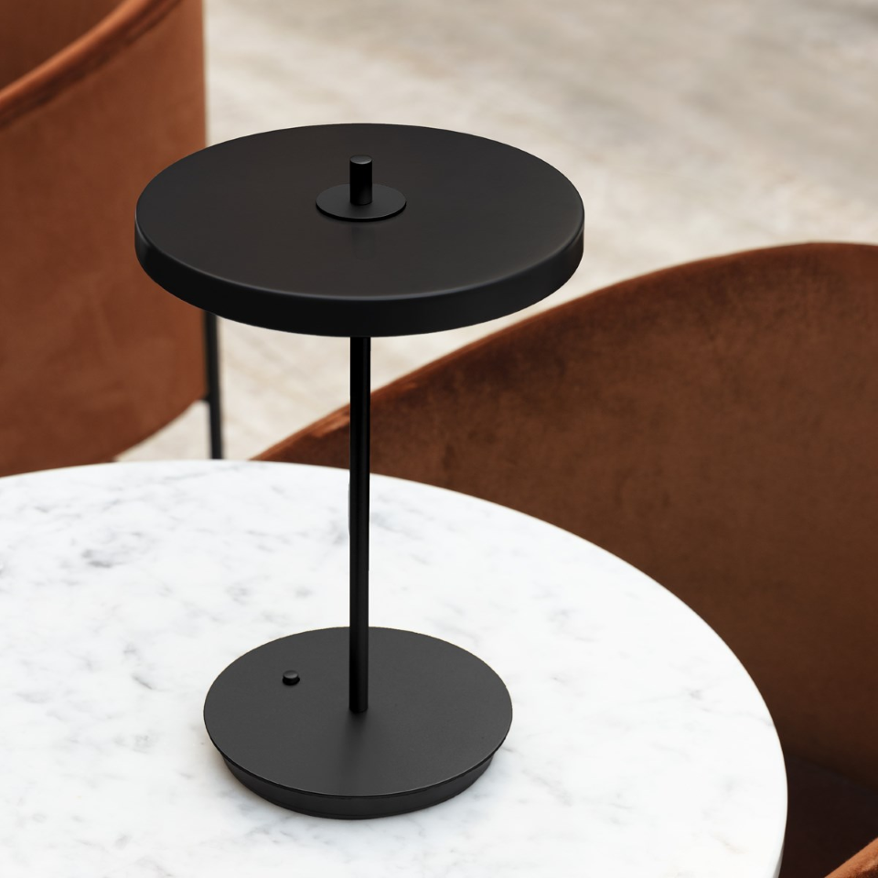 UMAGE Asteria Move Portable Table Lamp - Black / Black — styled interior view