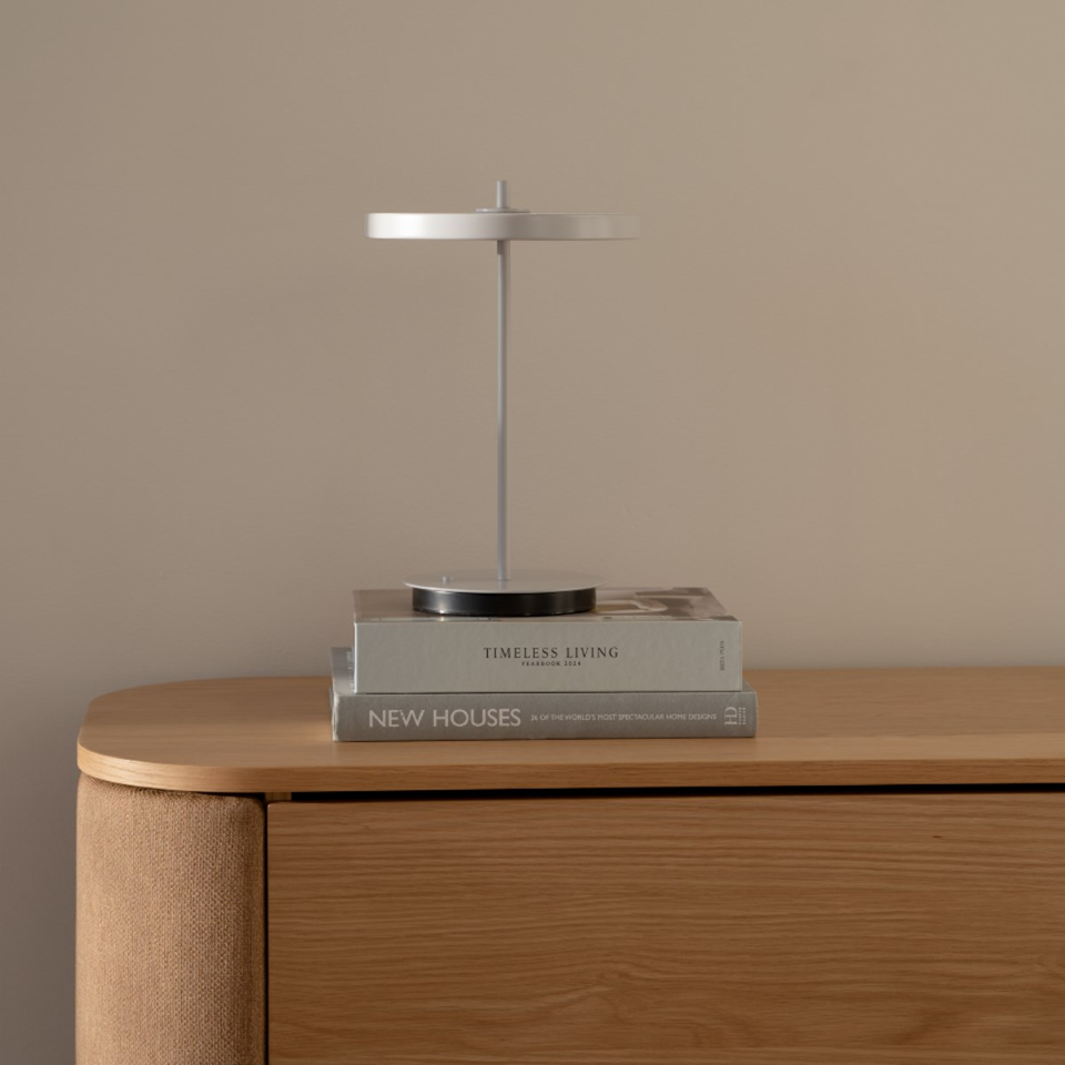 UMAGE Asteria Move Monochrome Portable Table Lamp - Nuance Mist — styled interior view