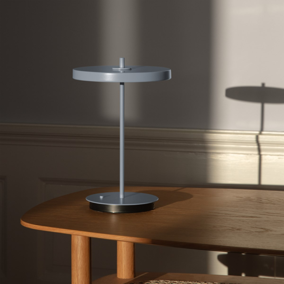 UMAGE Asteria Move Monochrome Portable Table Lamp - Pale Blue — styled interior view