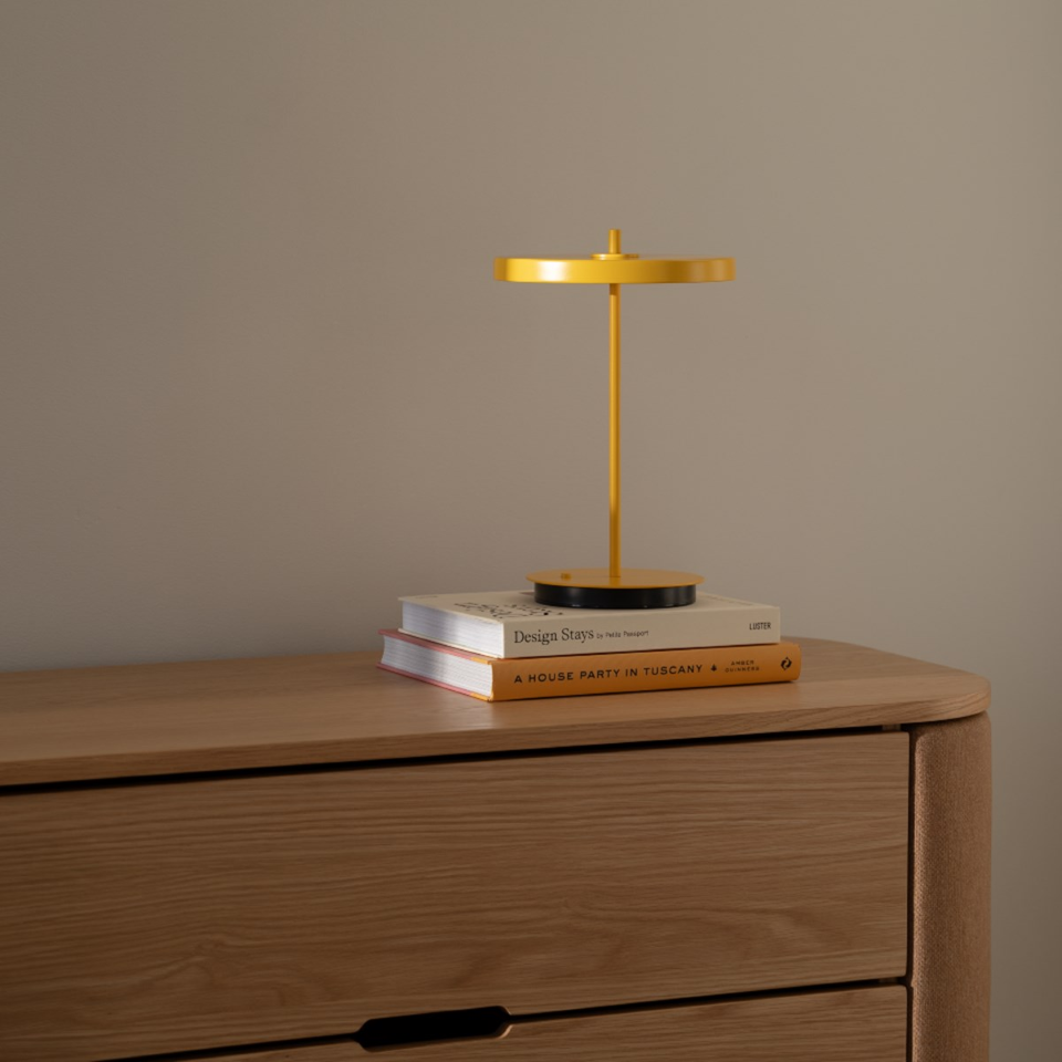 UMAGE Asteria Move Monochrome Portable Table Lamp - Sunflower — styled interior view