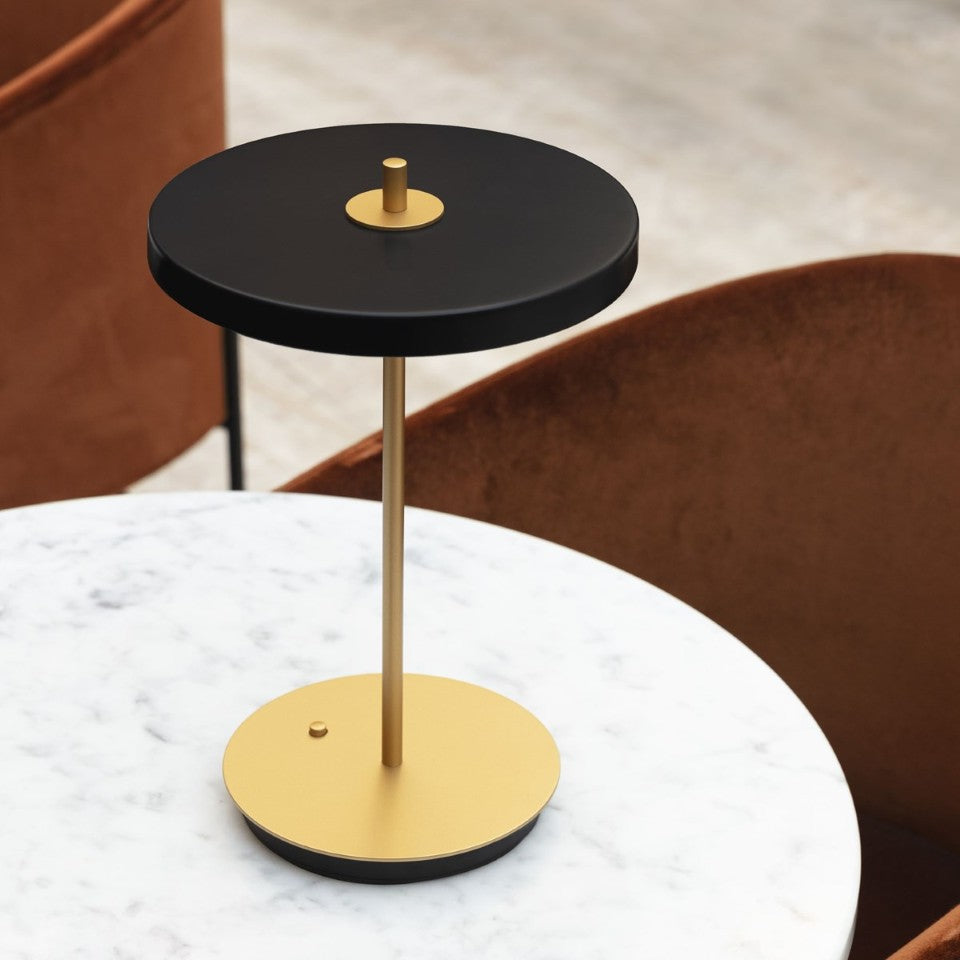 UMAGE Asteria Move LED Portable Table Lamp in Black — styled interior view