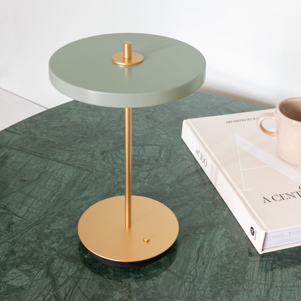 UMAGE Asteria Move LED Portable Table Lamp in Nuance Olive — styled interior view 17