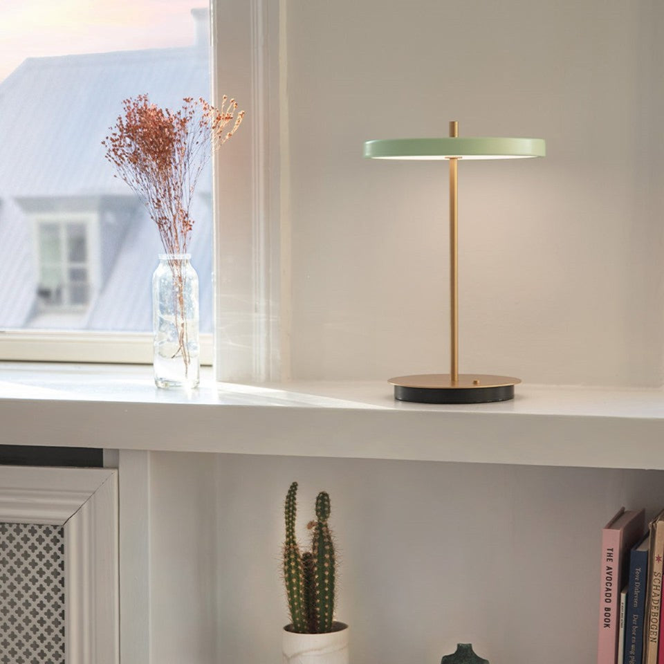 UMAGE Asteria Move LED Portable Table Lamp in Nuance Olive — styled interior view 14