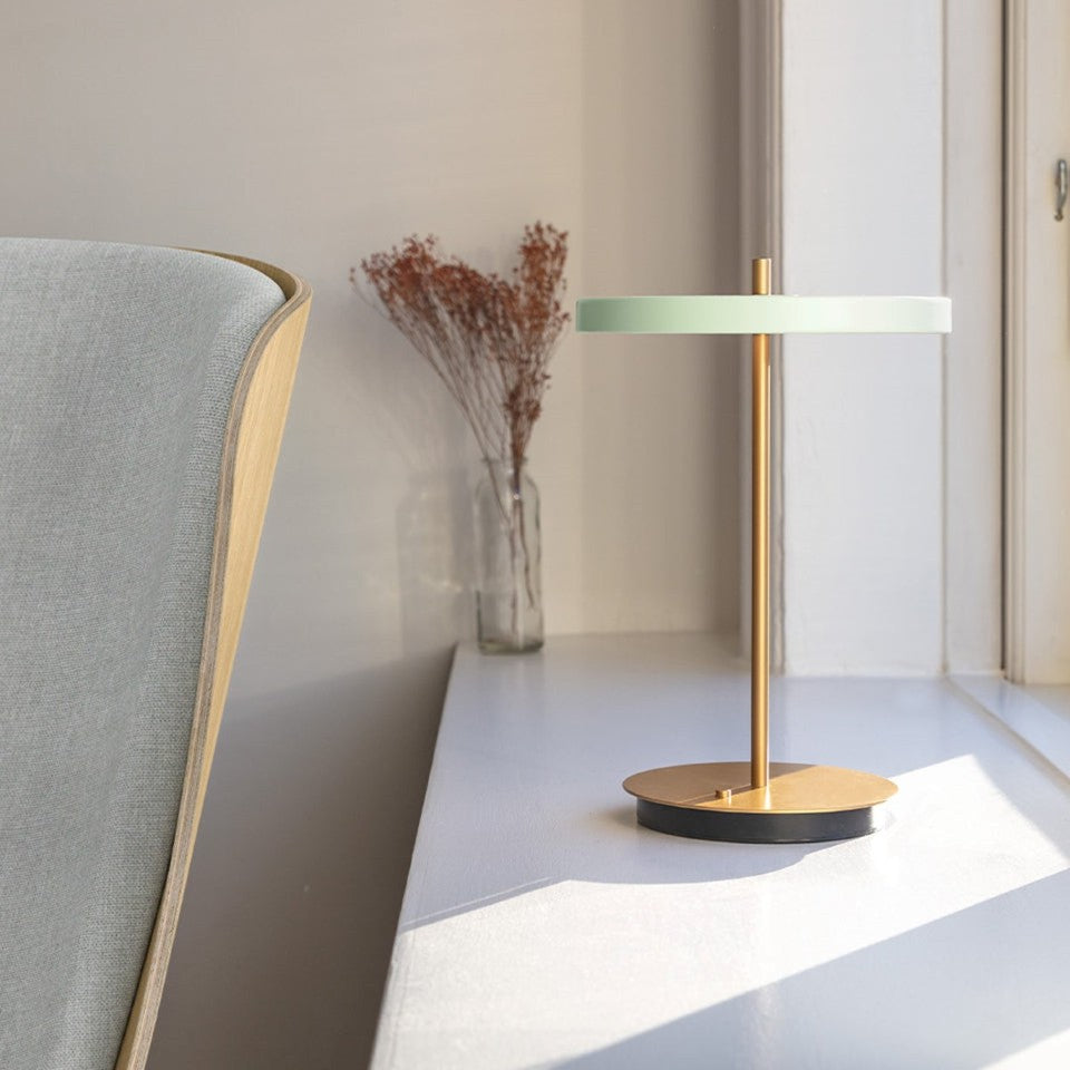 UMAGE Asteria Move LED Portable Table Lamp in Nuance Olive — styled interior view 6