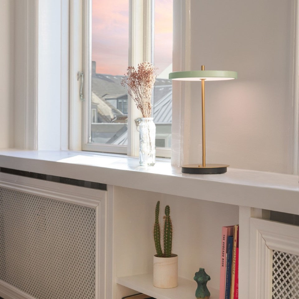 UMAGE Asteria Move LED Portable Table Lamp in Nuance Olive — styled interior view 5