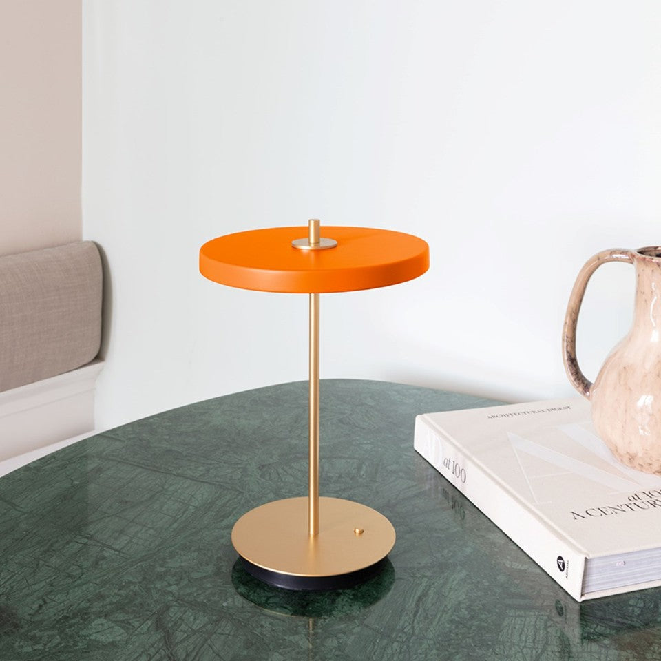 UMAGE Asteria Move LED Portable Table Lamp in Nuance Orange — styled interior view 2