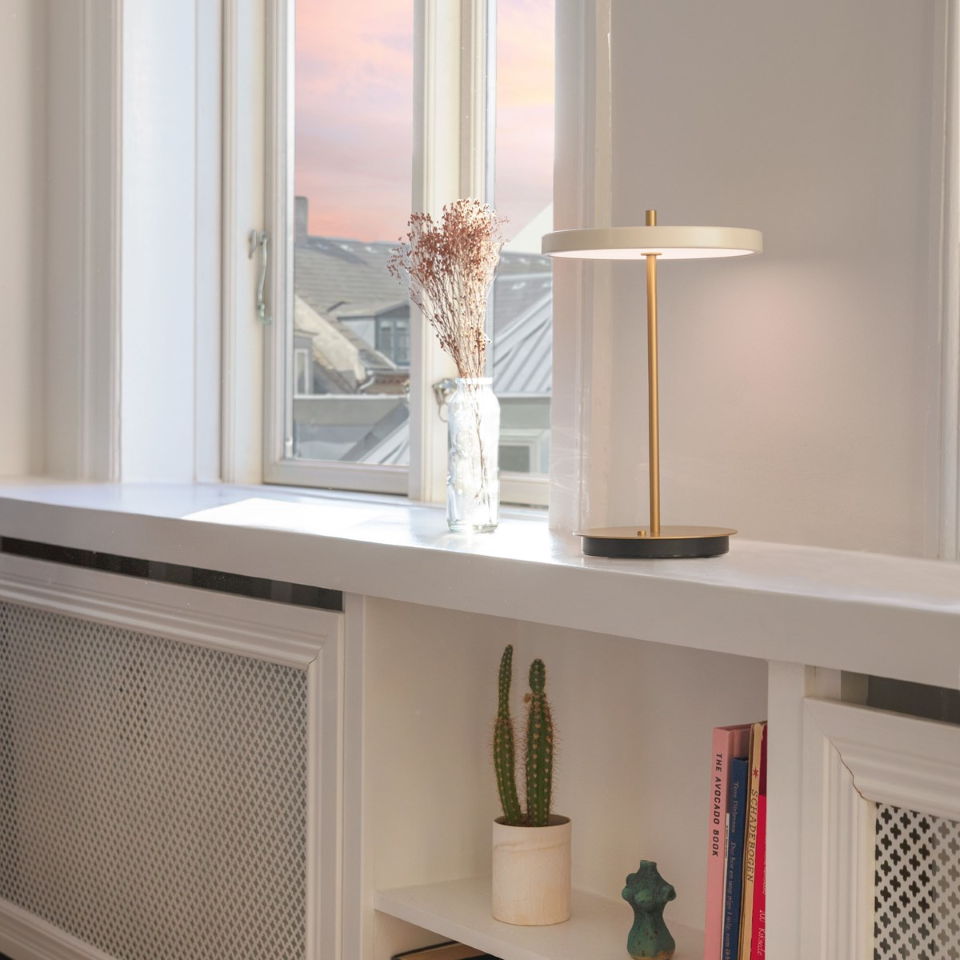 UMAGE Asteria Move LED Portable Table Lamp in Pearl White — styled interior view 11