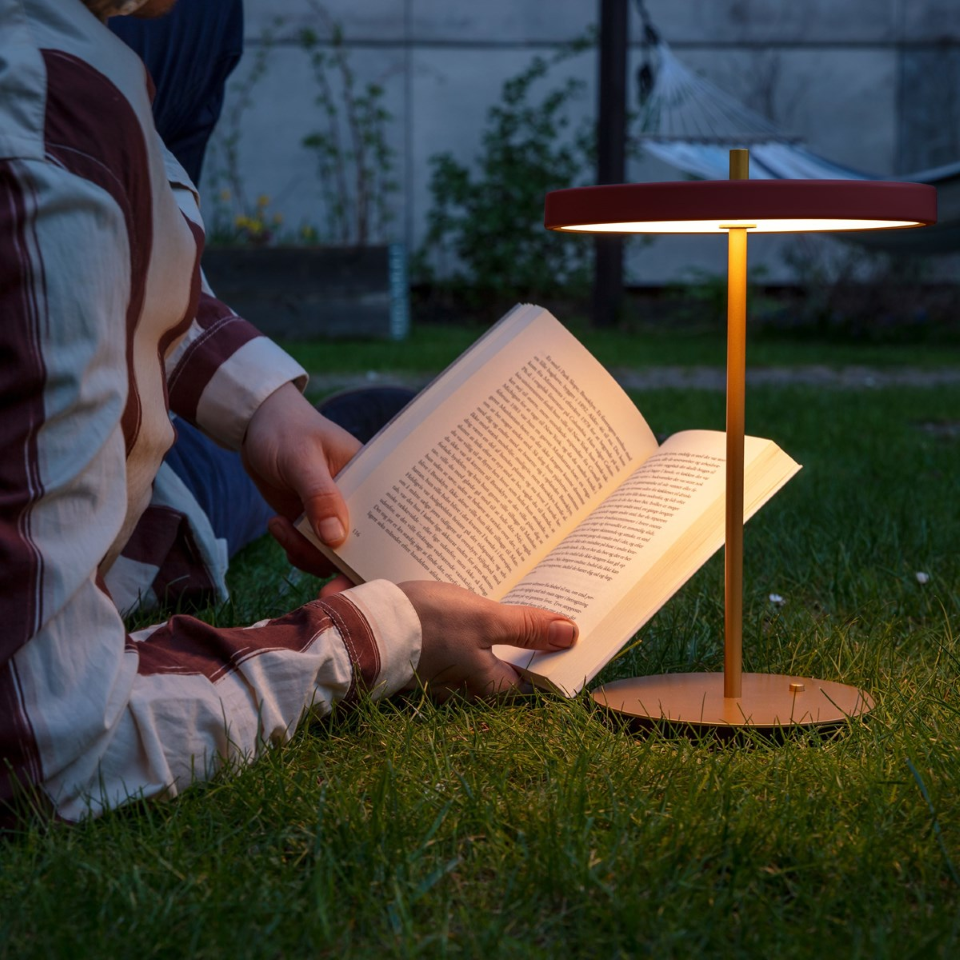 UMAGE Asteria Move LED Portable Table Lamp in Ruby Red — styled interior view 12