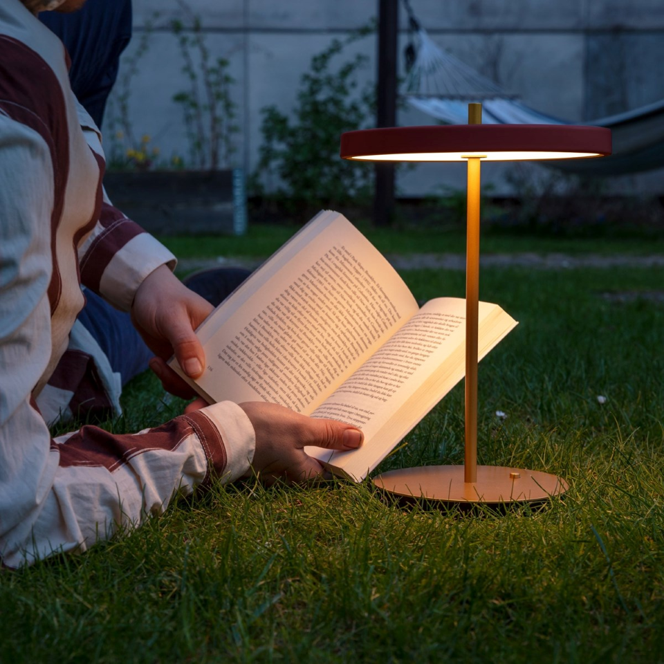 UMAGE Asteria Move LED Portable Table Lamp in Ruby Red — styled interior view 10