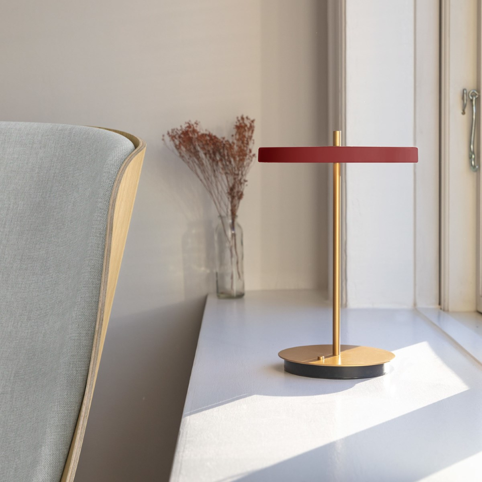 UMAGE Asteria Move LED Portable Table Lamp in Ruby Red — styled interior view 3