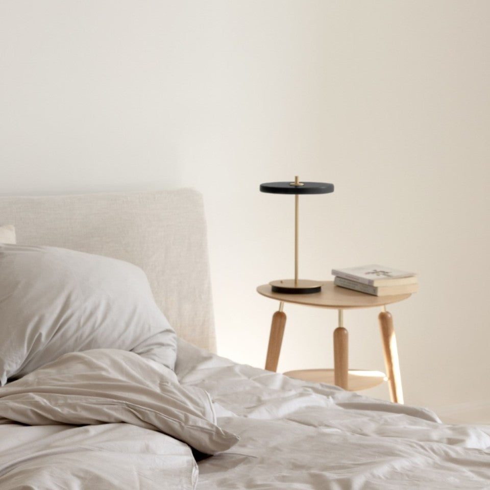 UMAGE Asteria Move LED Portable Table Lamp in Black — styled interior view 8