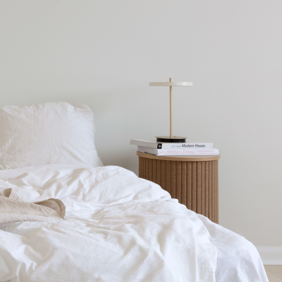 UMAGE Asteria Move LED Portable Table Lamp in Pearl White — styled interior view 6
