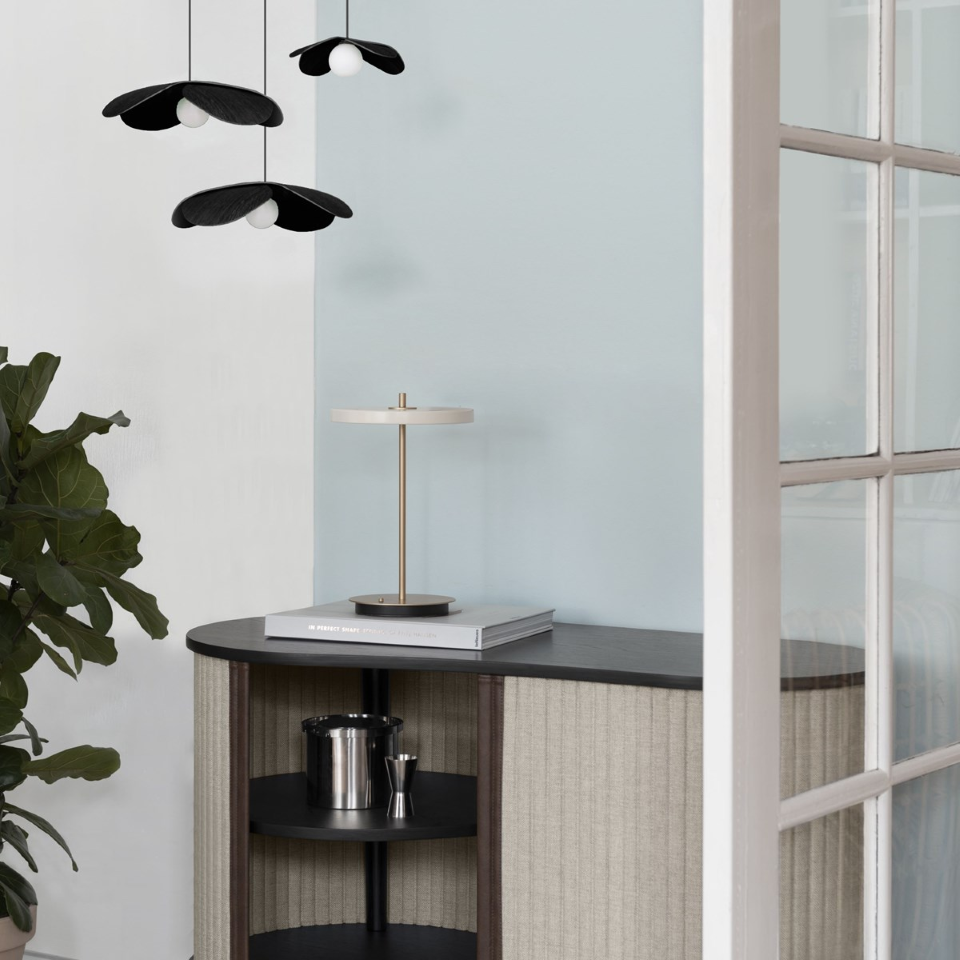 UMAGE Asteria Move LED Portable Table Lamp in Pearl White — styled interior view 4