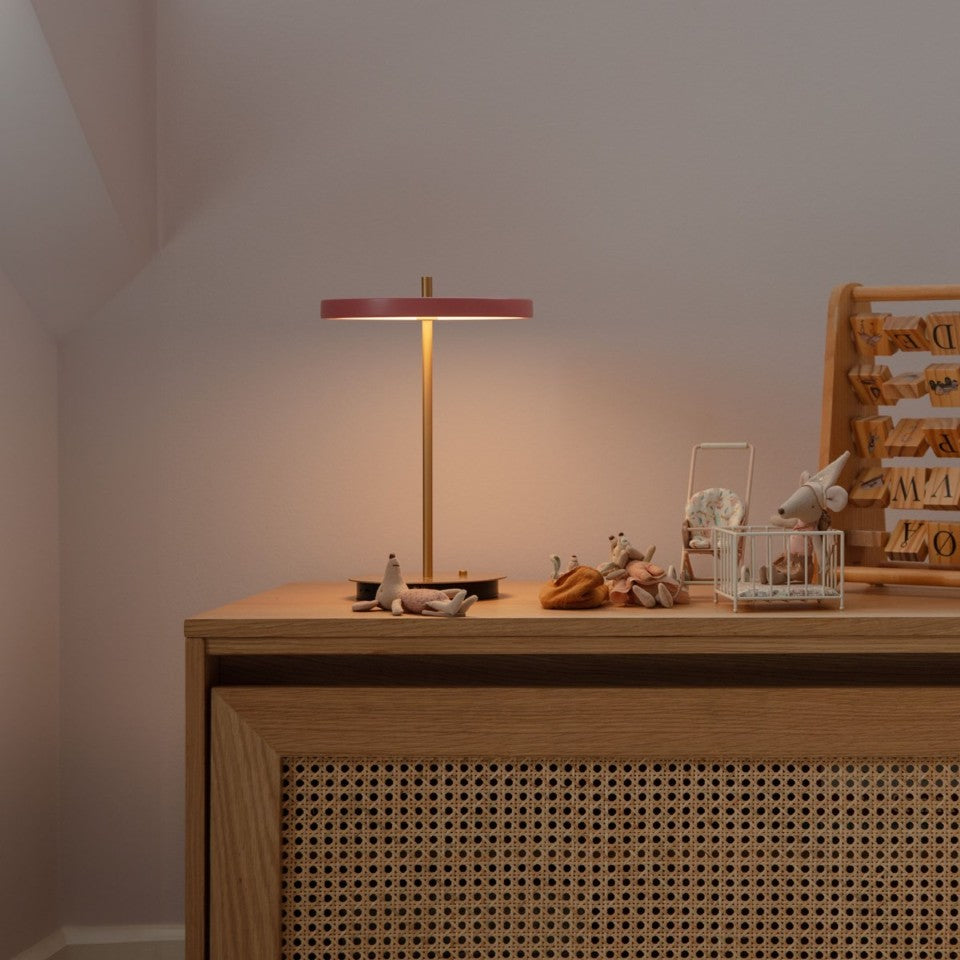 UMAGE Asteria Move LED Portable Table Lamp in Nuance Rose — styled interior view 5