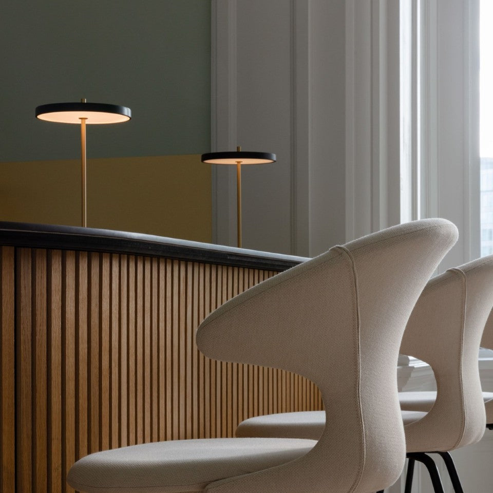 UMAGE Asteria Move LED Portable Table Lamp in Black — styled interior view 10