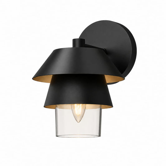 Modern Alora Mood Tetsu bathroom vanity light featuring stacked matte black metal shades, clear cylindrical glass, and elegant single-light illumination